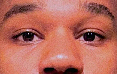 Close-up of the artist Duckai's eyes and nose, focusing on the eye area.