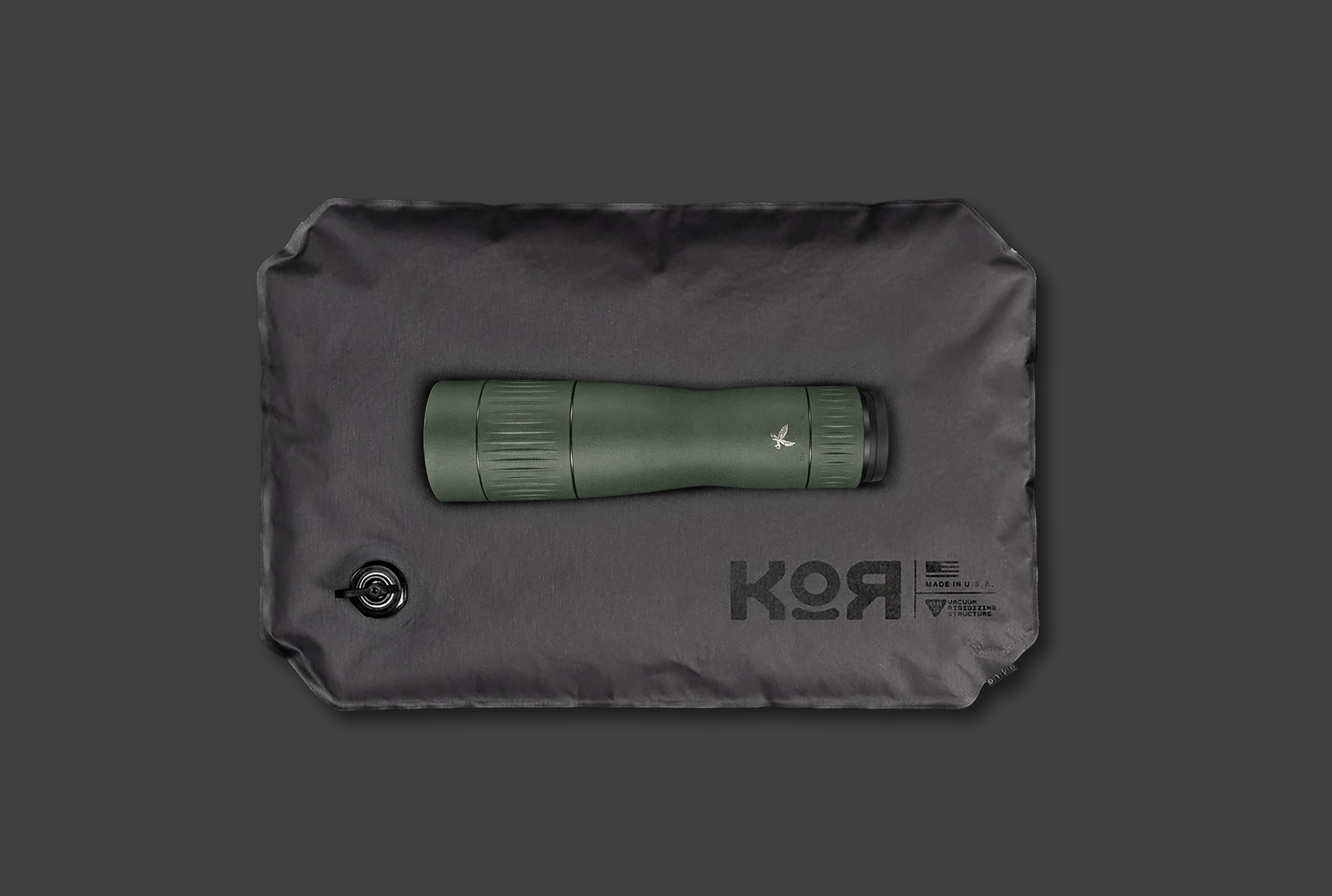 A green Range Finder, Optic.  On a KOR Protection System single panel. In its fluid soft state On a gray background.