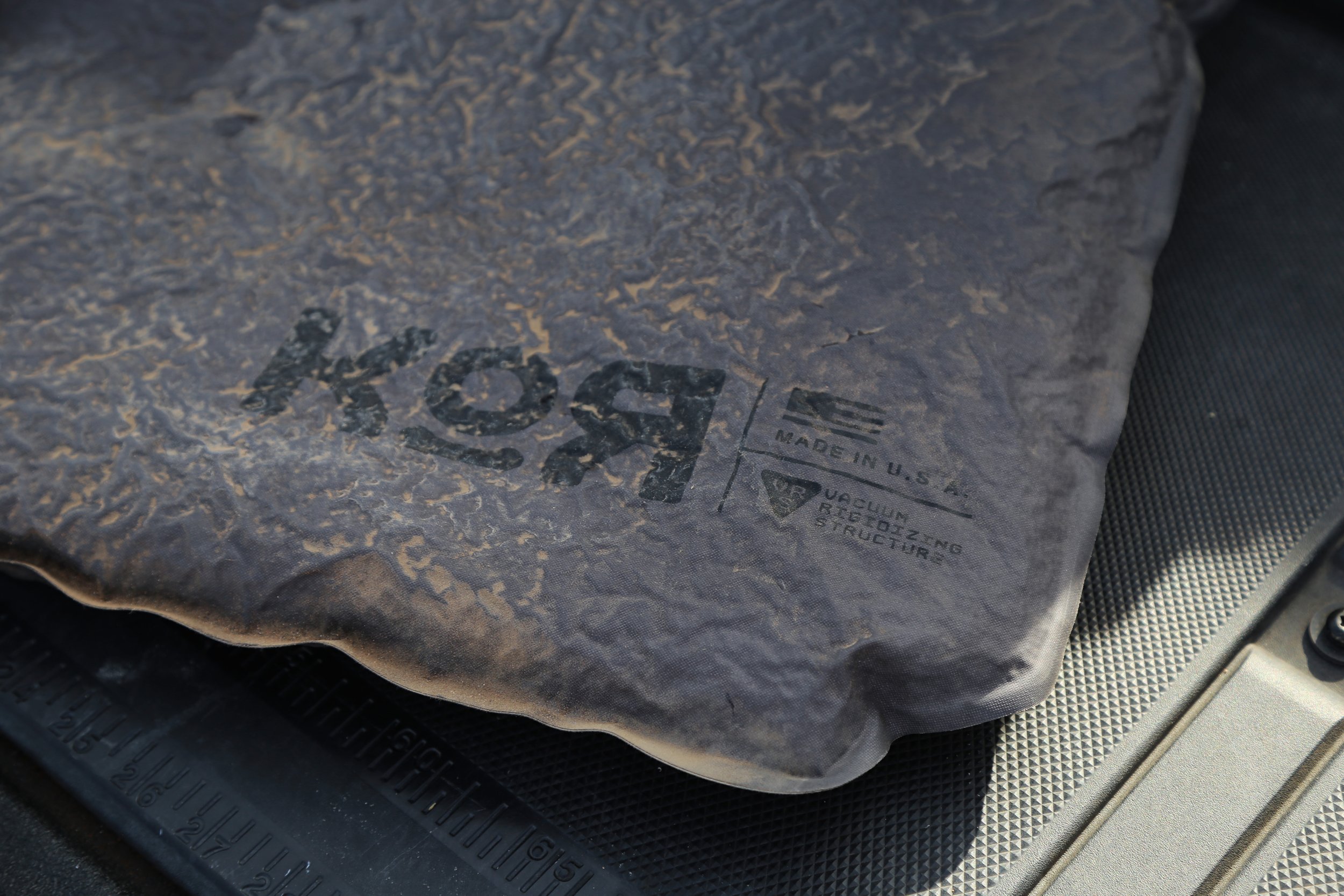 KOR Vacuum Rigidizing Structure (VRS) panel covered in dust after heavy use, demonstrating its durable, waterproof, dustproof construction for mission-critical gear protection.