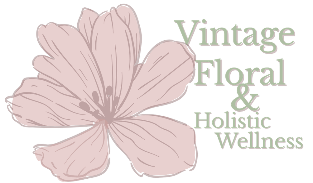A pink flower with five petals and a text overlay that reads 'Vintage Floral & Holistic Wellness'.