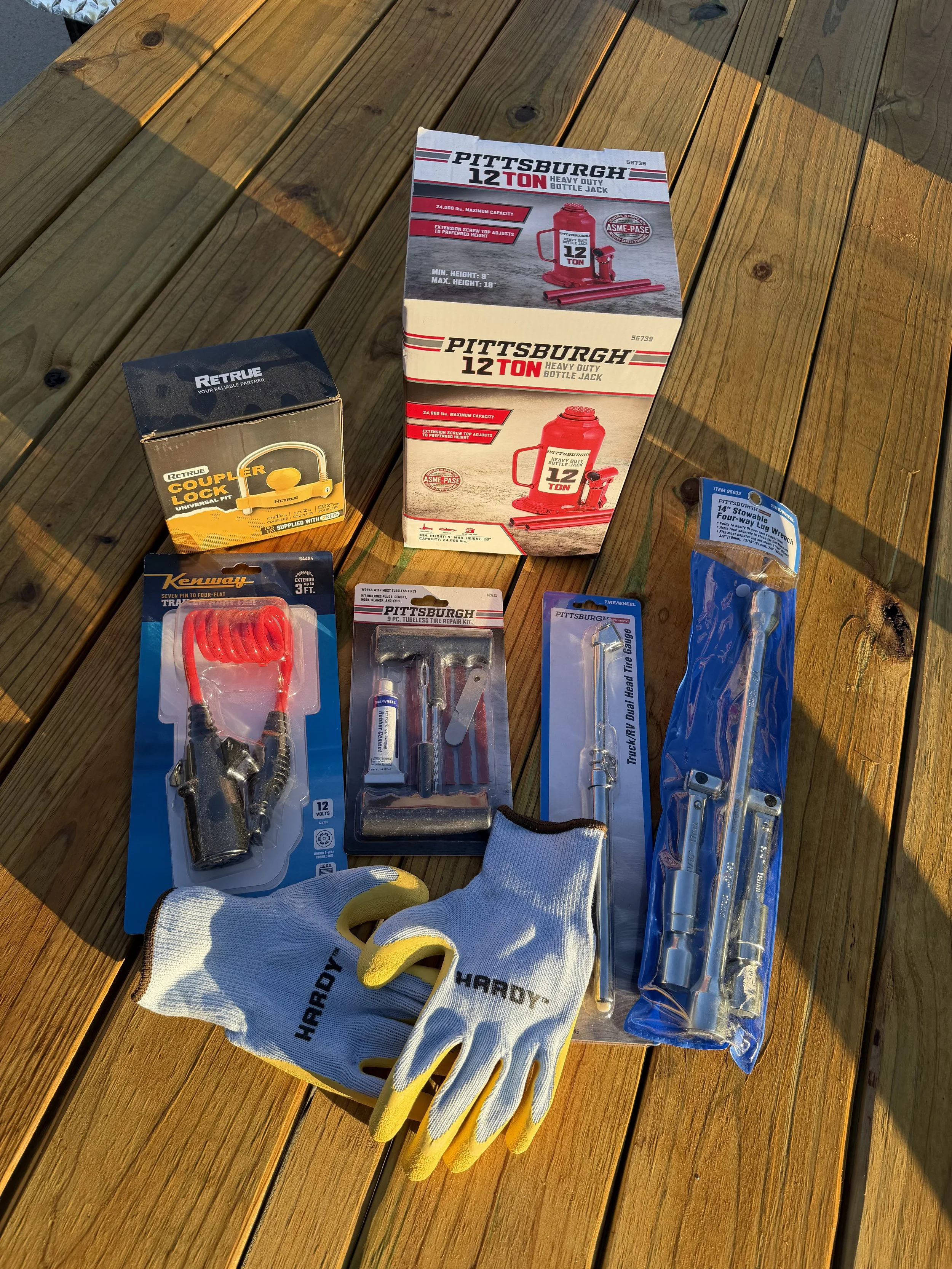 4-way lug wrench, Tire pressure gauge, Tire plug/repair kit, Bottle jack, 7-way to 4-way adapter