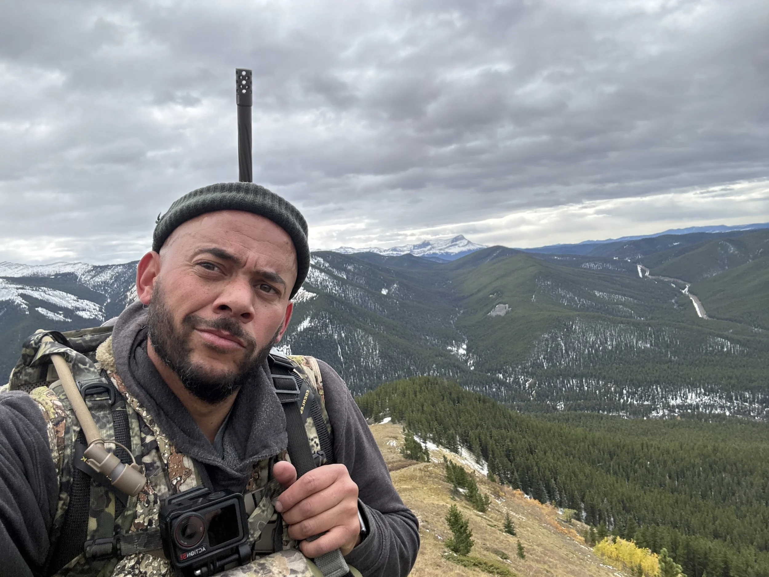 Rustic Roots Outdoors creator hiking through the Canadian Rockies in Alberta during a wilderness adventure.
