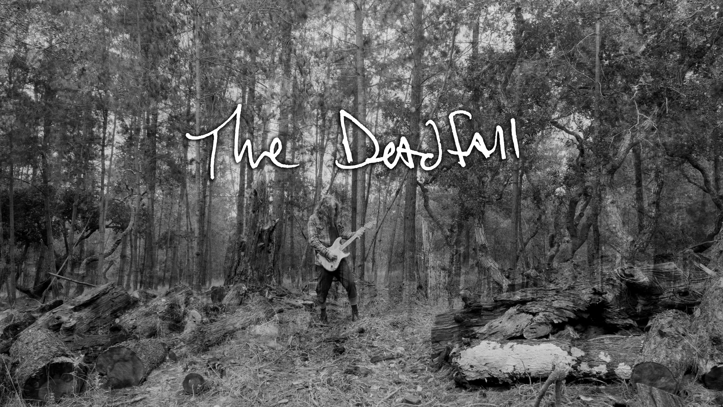 Black and white photo of a person standing in a wooded forest, playing an electric guitar, with the words 'The Beast' written in graffiti style across the top.