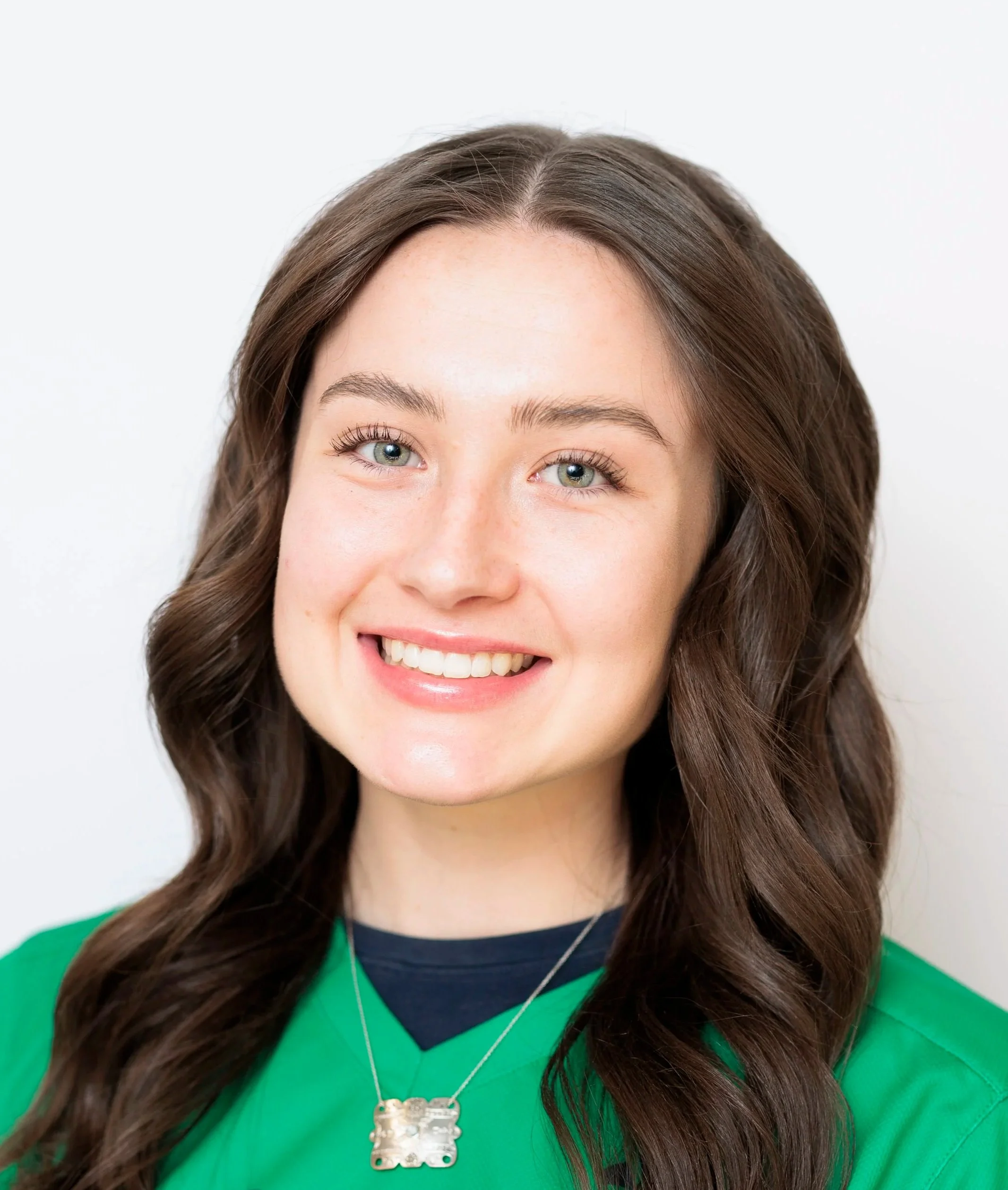 College girl with brown hair headshot.