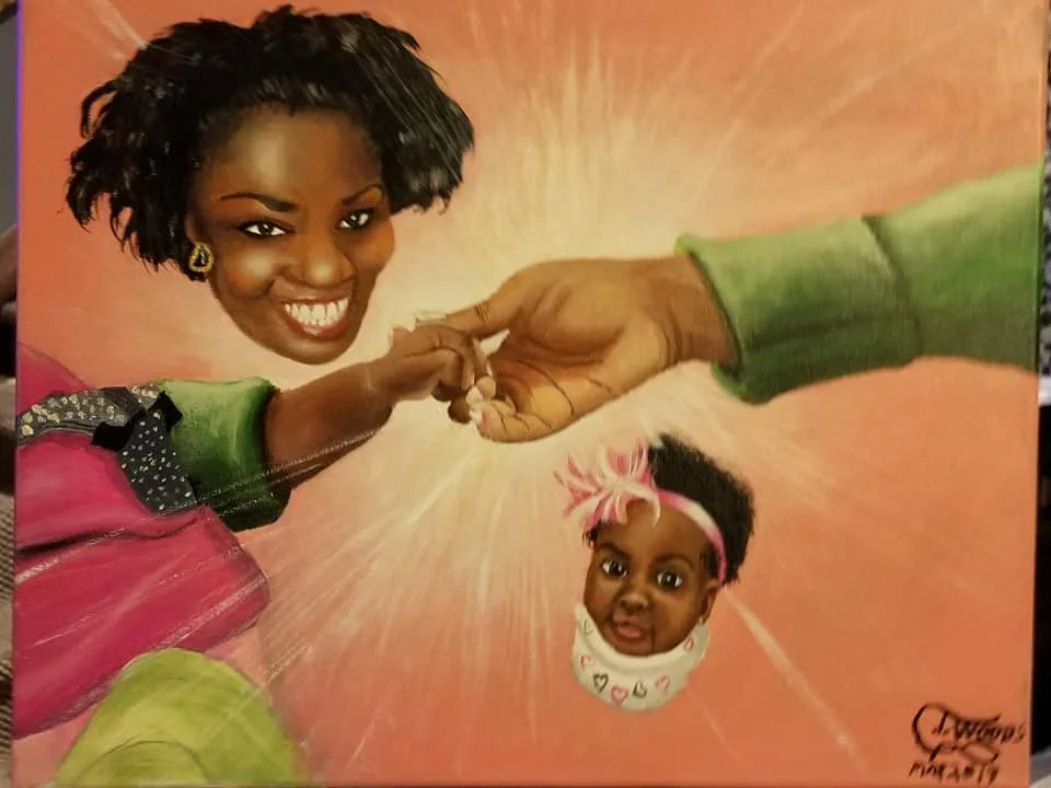 A painting of a woman with a big smile and earrings, with her hand holding the finger of a man, and below them a baby’s head with a pink headband emerging from a white swaddle with hearts. The background has orange and pink hues.