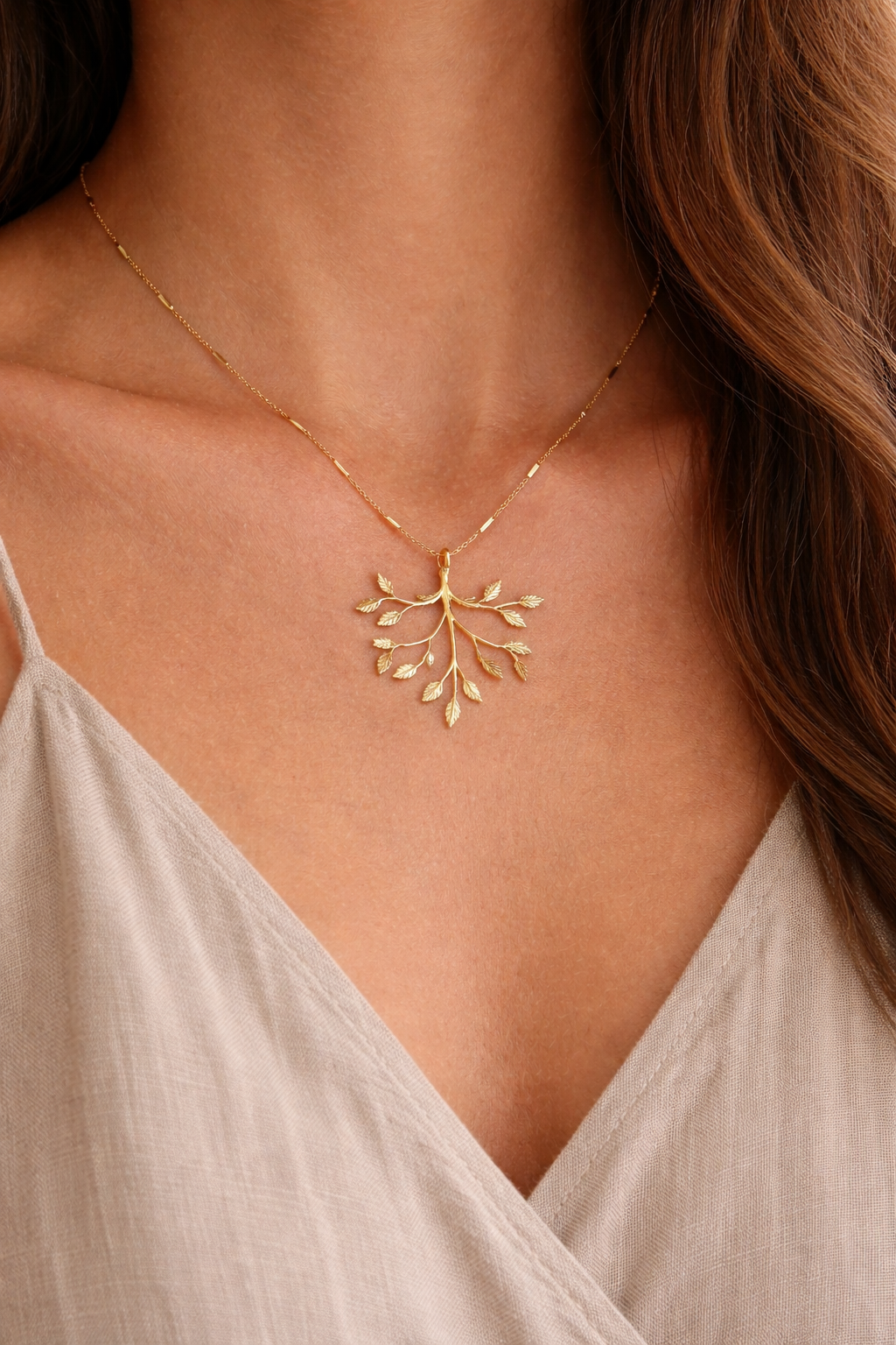 abide gold branch necklace worn on neck dainty faith inspired jewelry