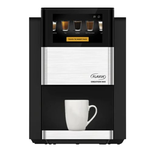 A Flavia Creation 600 coffee machine dispensing coffee into a white mug.