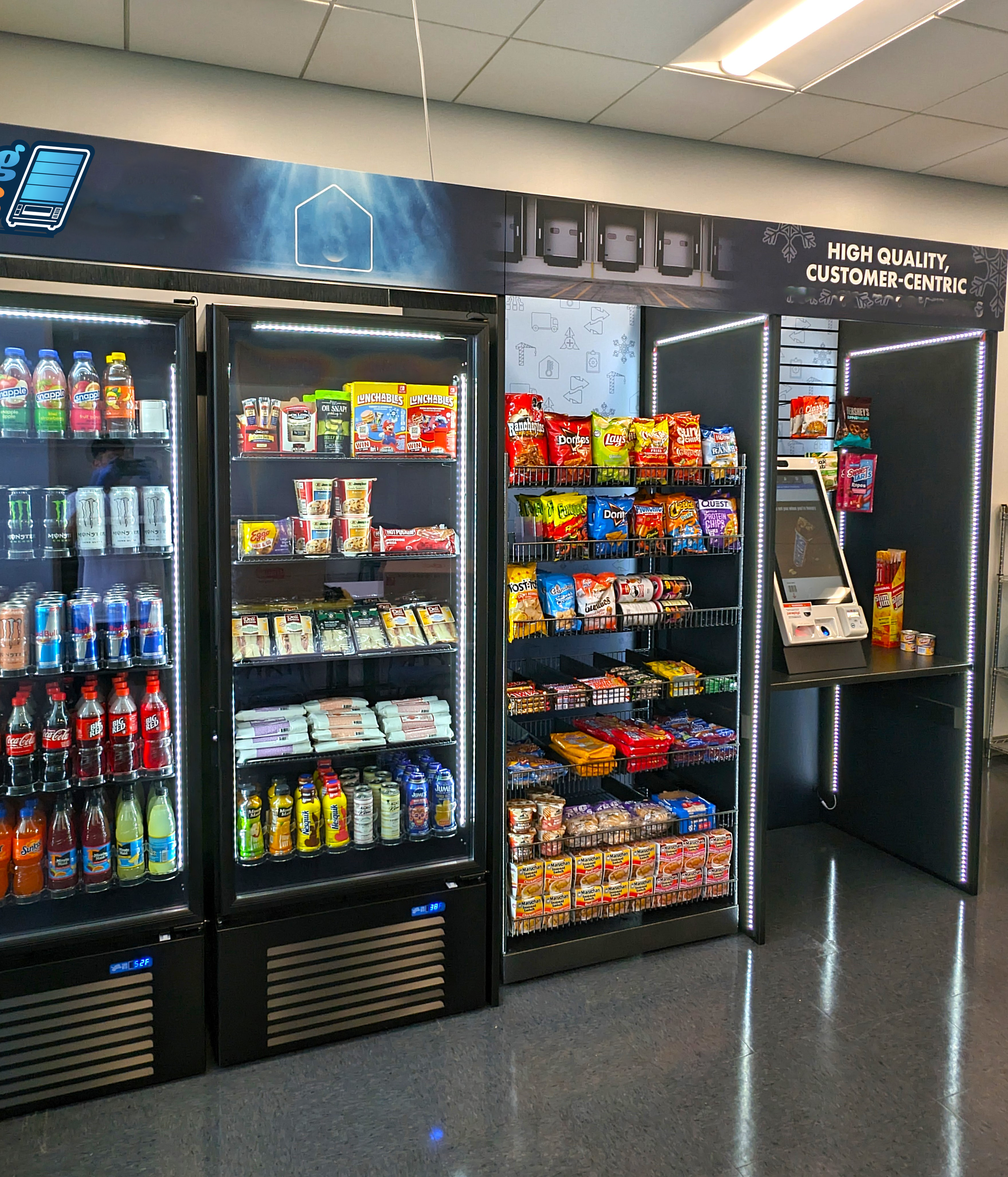 Refrigerator display of beverages and snacks in a convenience store, with signage indicating high quality and customer focus, located on a tiled floor with bright ceiling lights.
