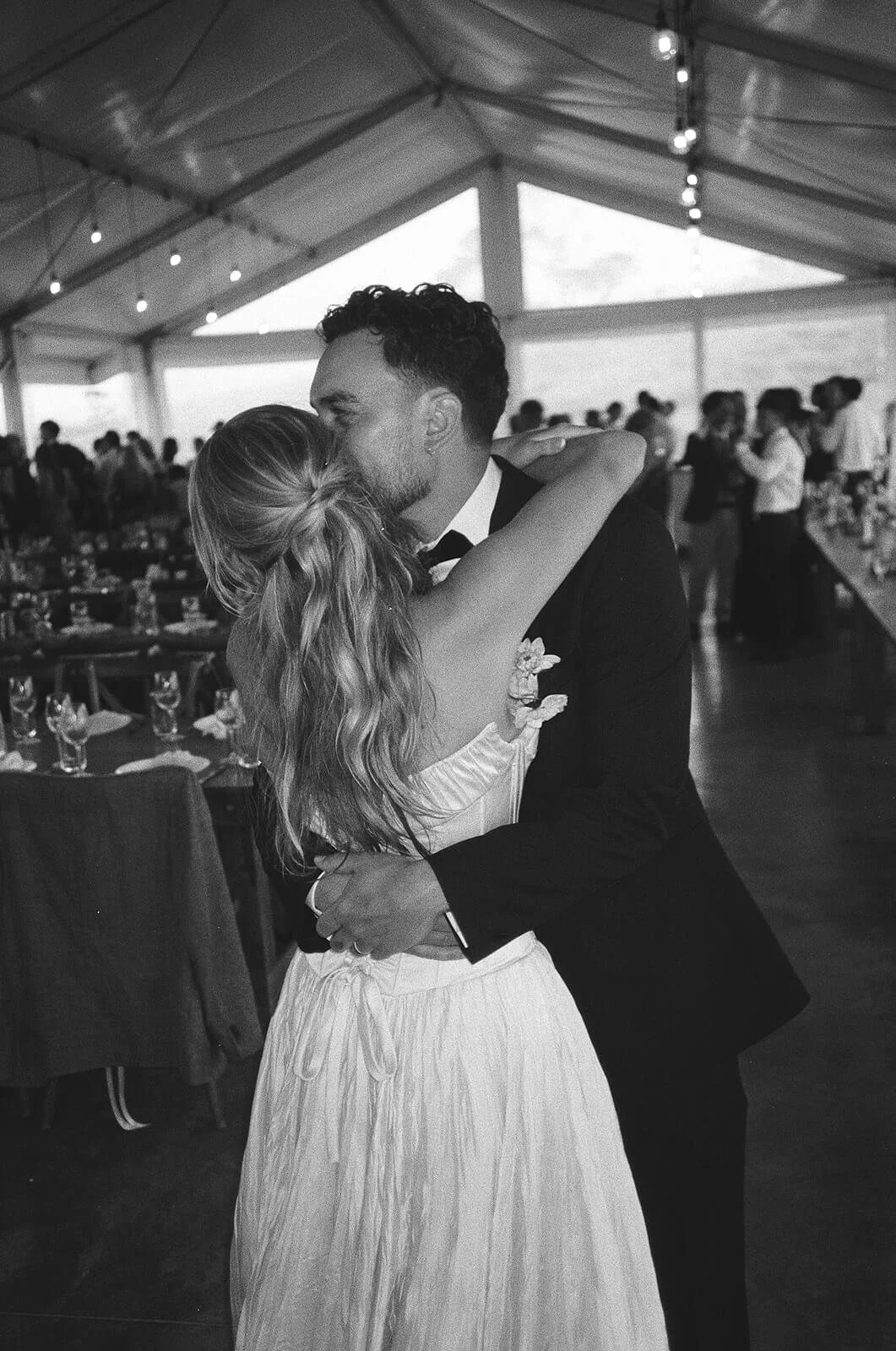 Black and white film photography inside the Bayly's Farm tent on a rainy day