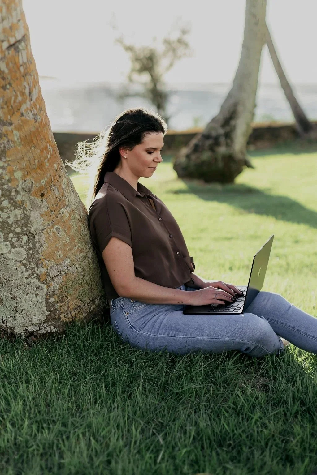 Girl sitting outside in Guam on computer