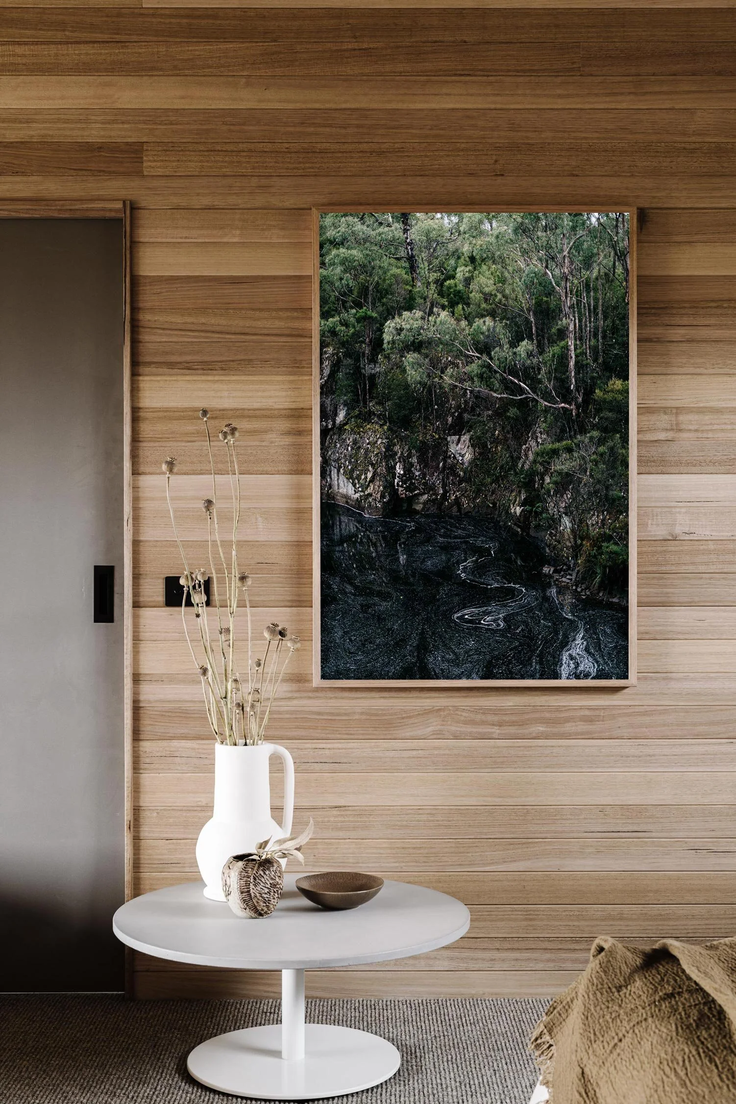 On the Road to Strahan print in a timber-lined room