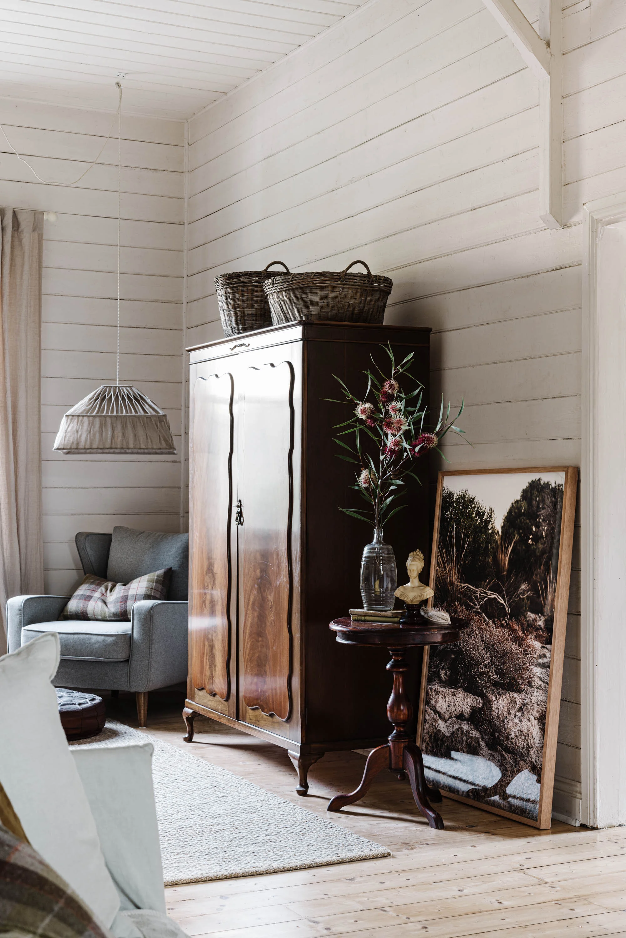 Waiting for Pizza in Coffin Bay print beside a timber cabinet