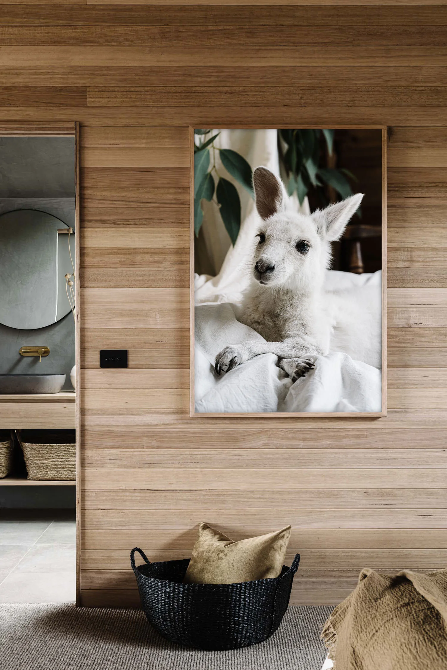 Angel the white kangaroo print in a timber-lined room