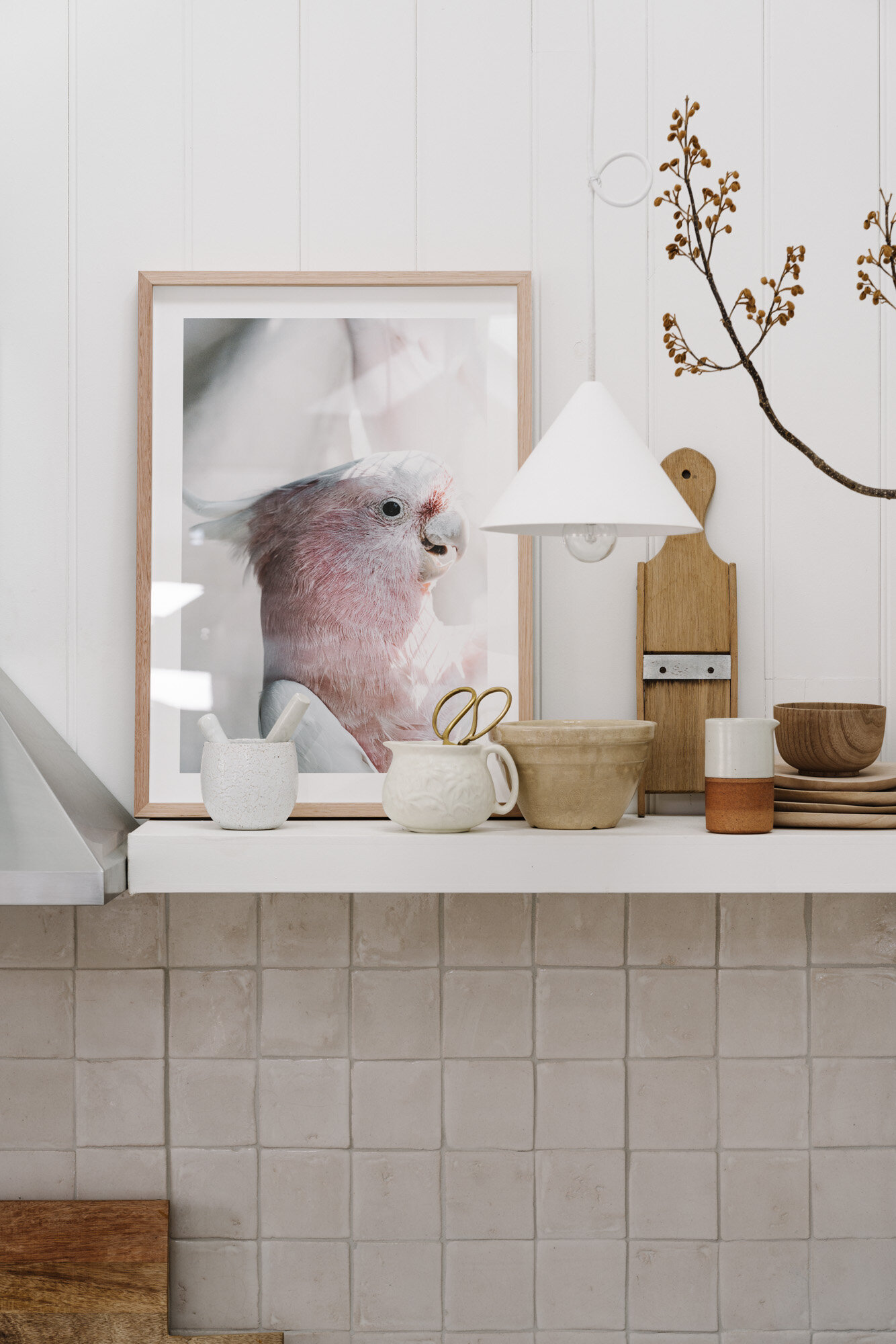 Birdy Num Nums the pink cockatoo print on a white mantel
