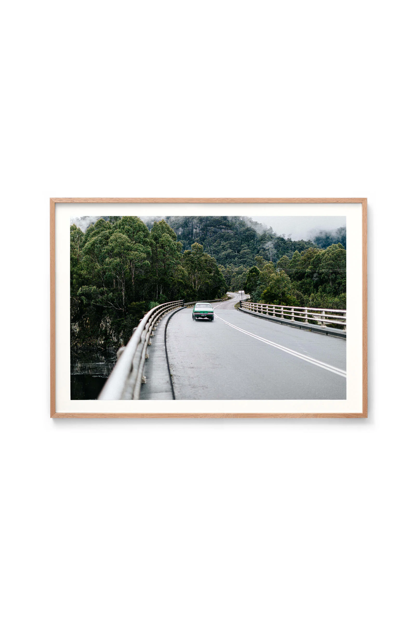 On the Road from Strahan print in an oak frame, landscape orientation