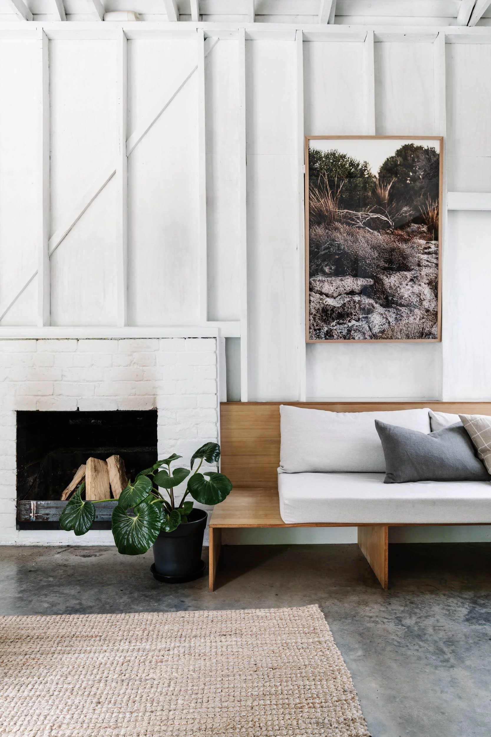 Waiting for Pizza in Coffin Bay print above a white fireplace