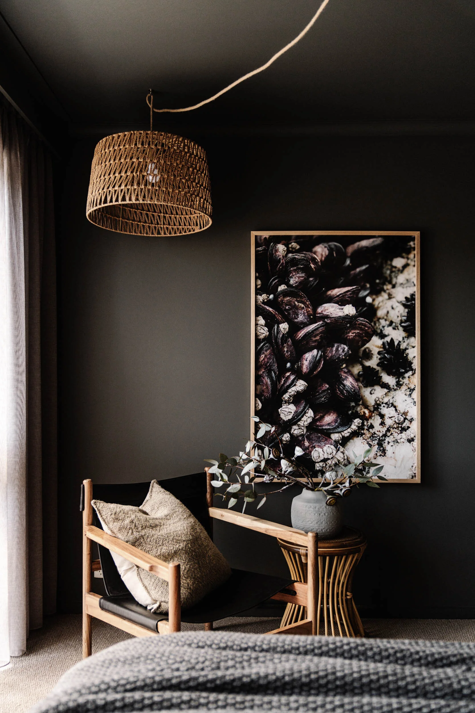 Very Shellfish print hanging in a dark bedroom