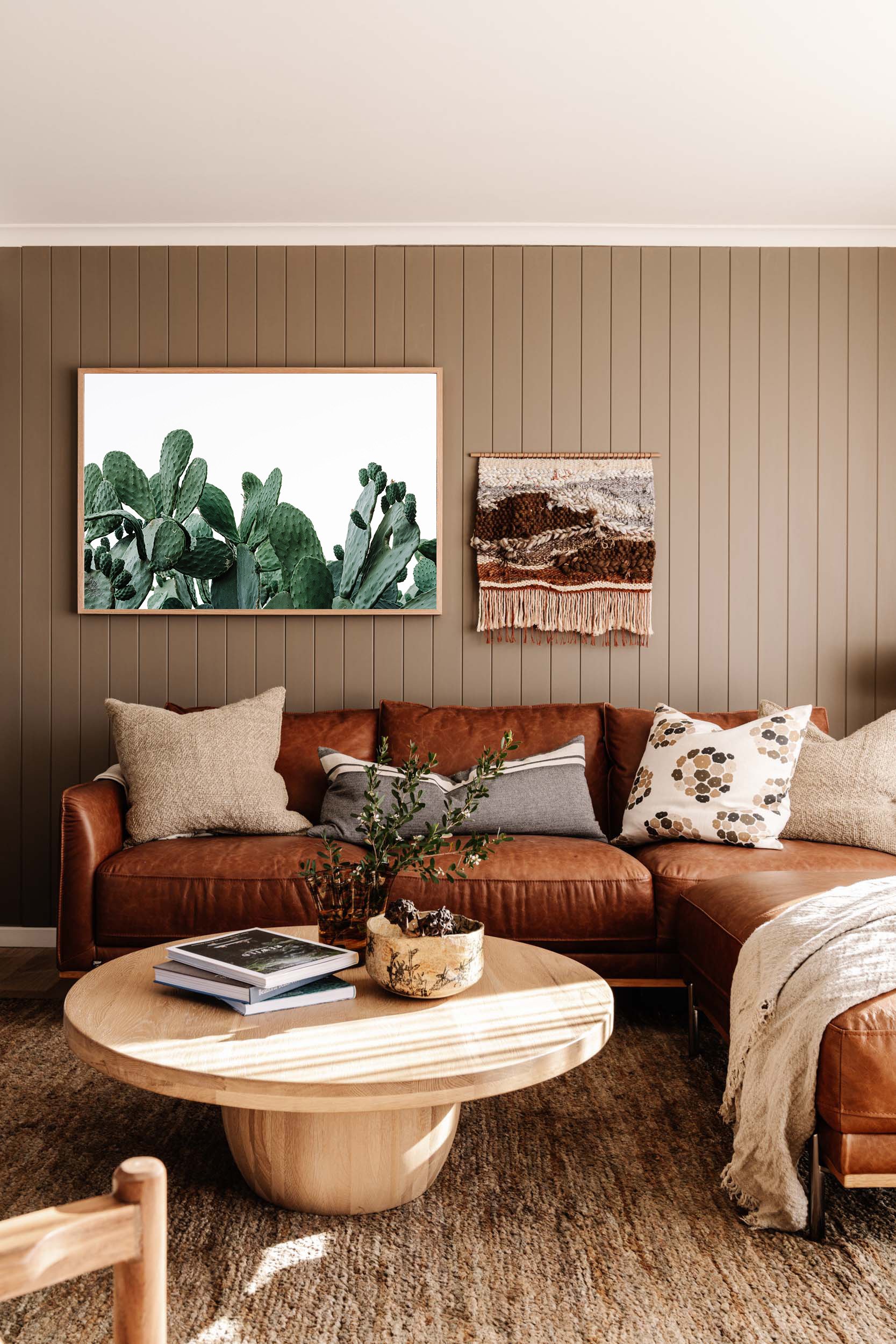 Prickles print above a tan leather sofa