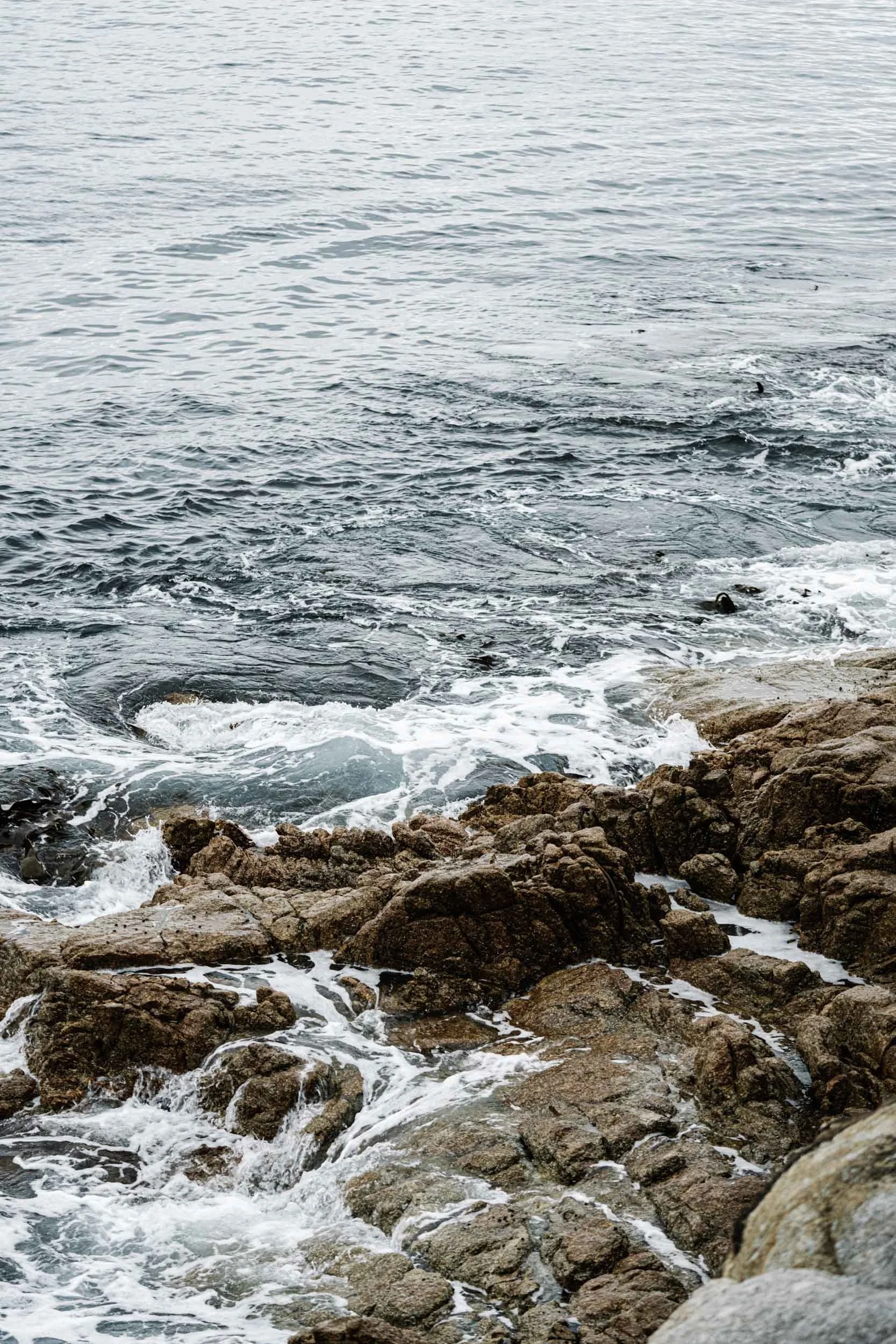 Waves washing over rocks at Skeleton Bay, fine art photograph