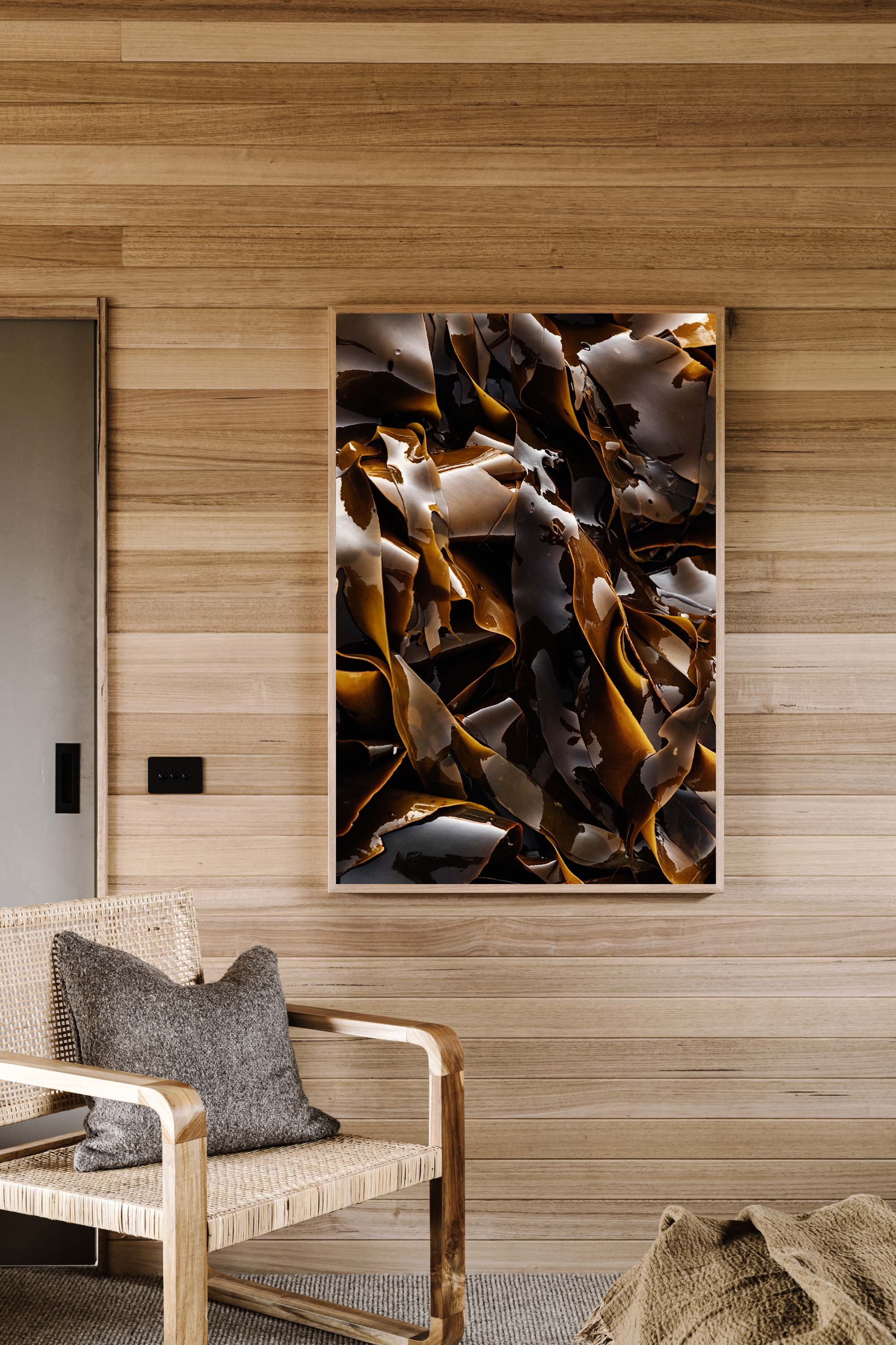 King Island kelp print hanging in a timber-lined room