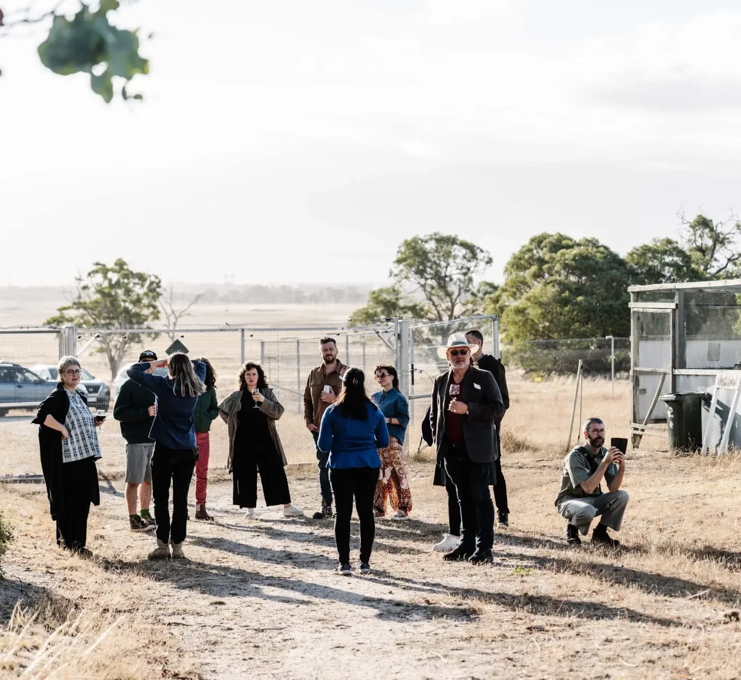 Group walking a dirt track during a wildlife sanctuary visit