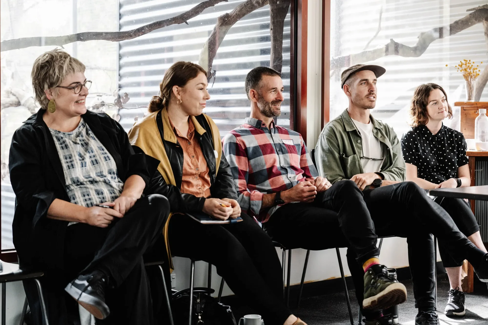 Participants seated in a row, listening during the Business of Biodiversity program.