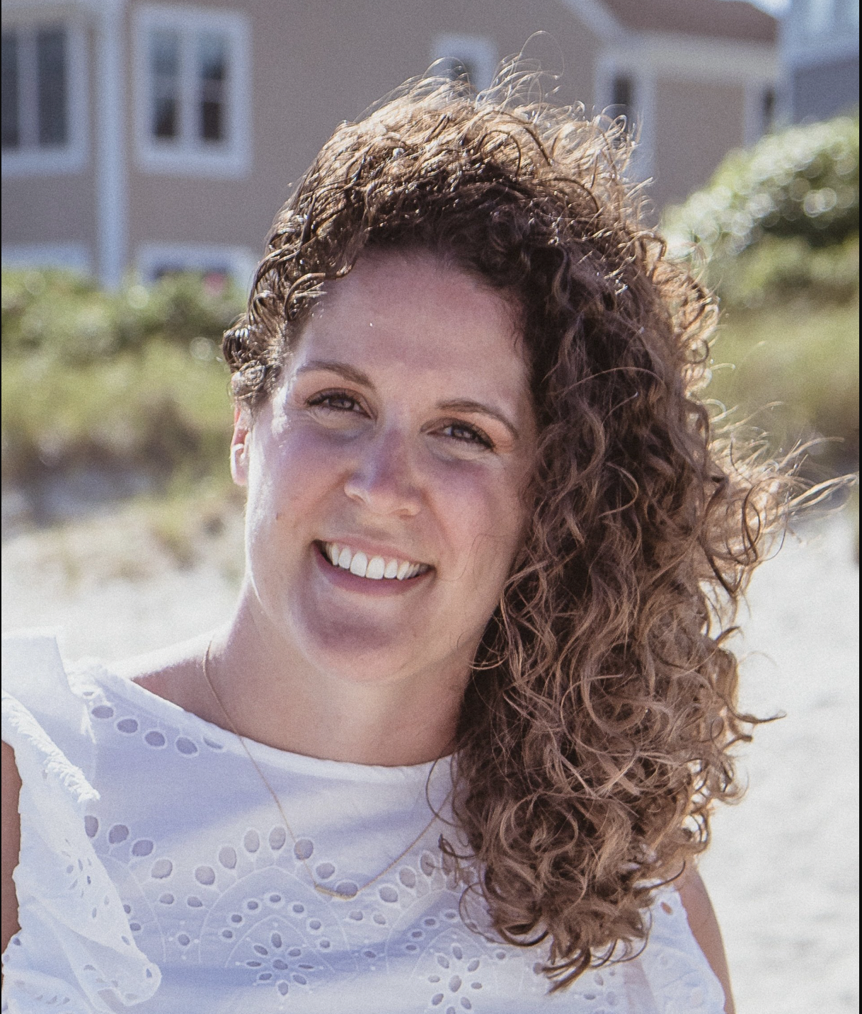 emma nelson physical therapist headshot on sandy beach dry needling expert