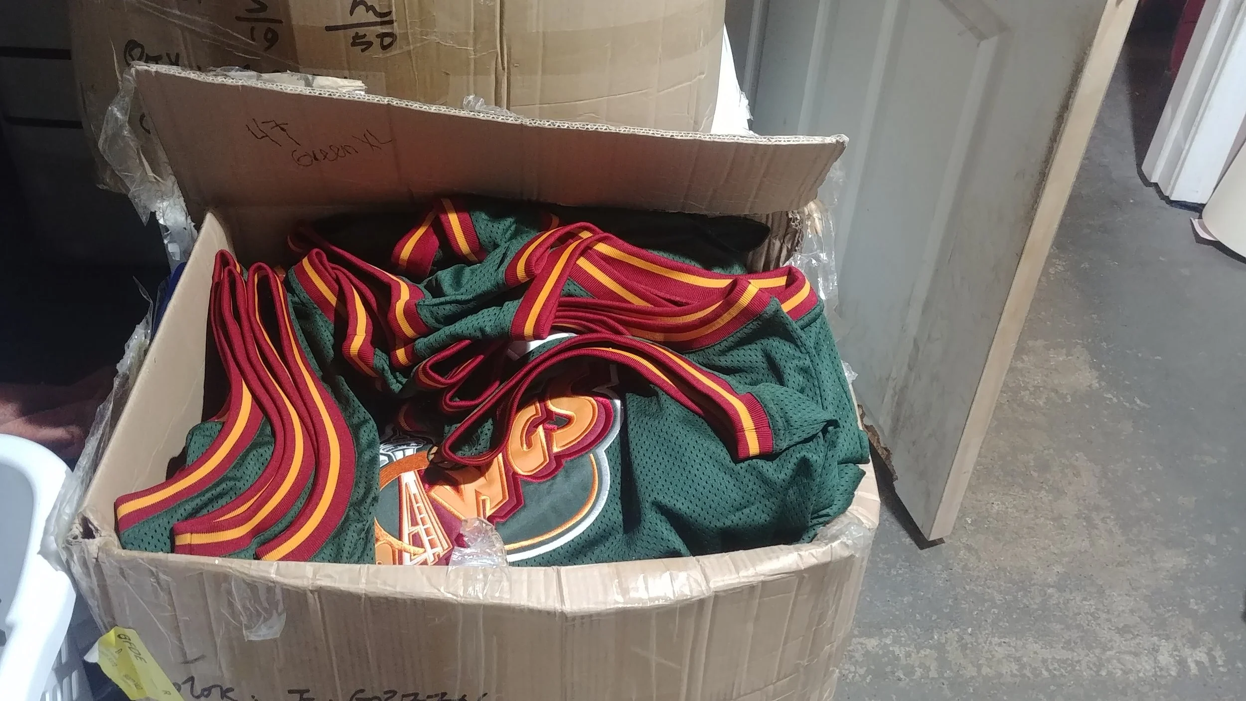 Sewing custom patches onto run of tops