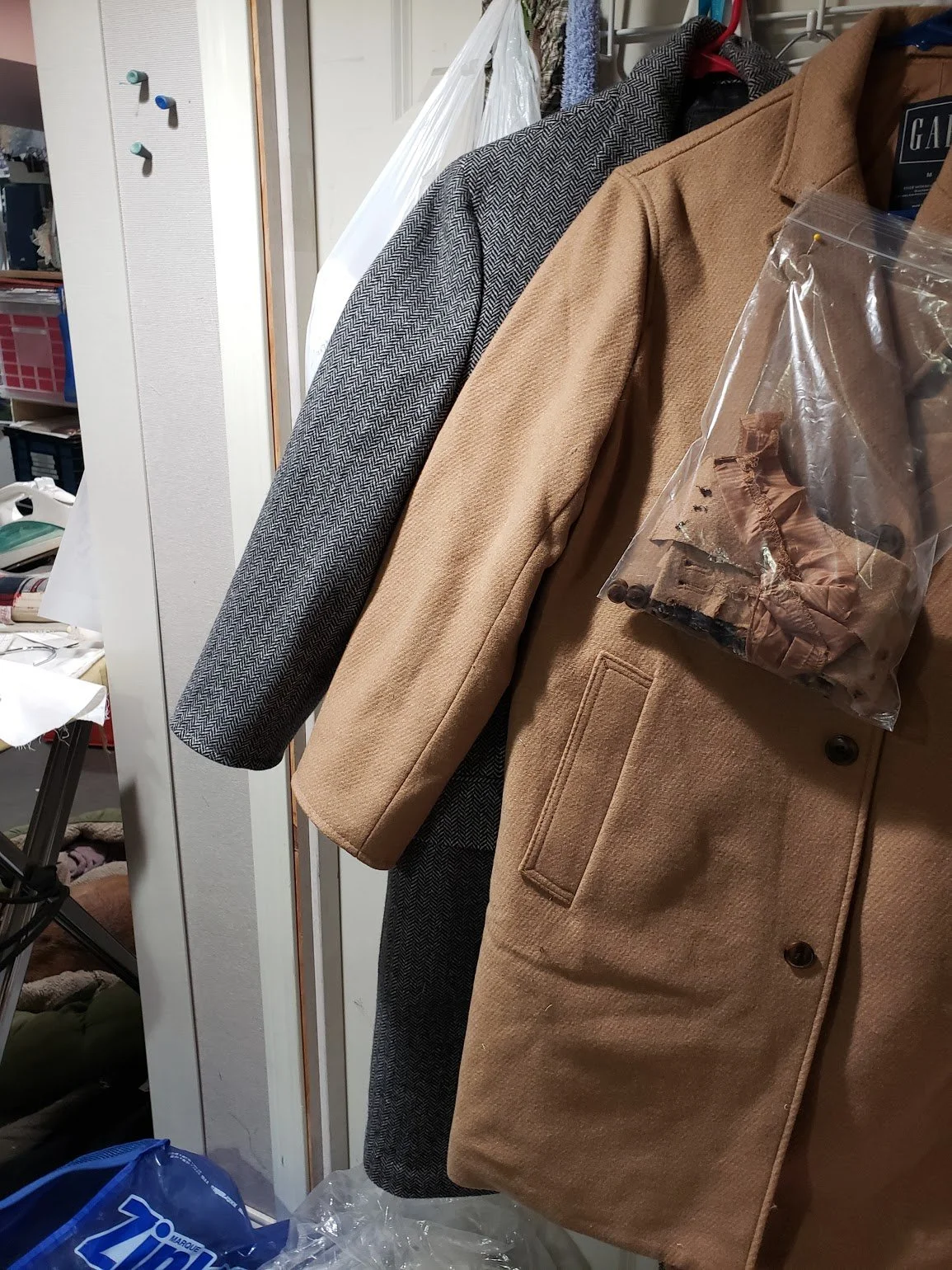 Altered sleeves of two coats