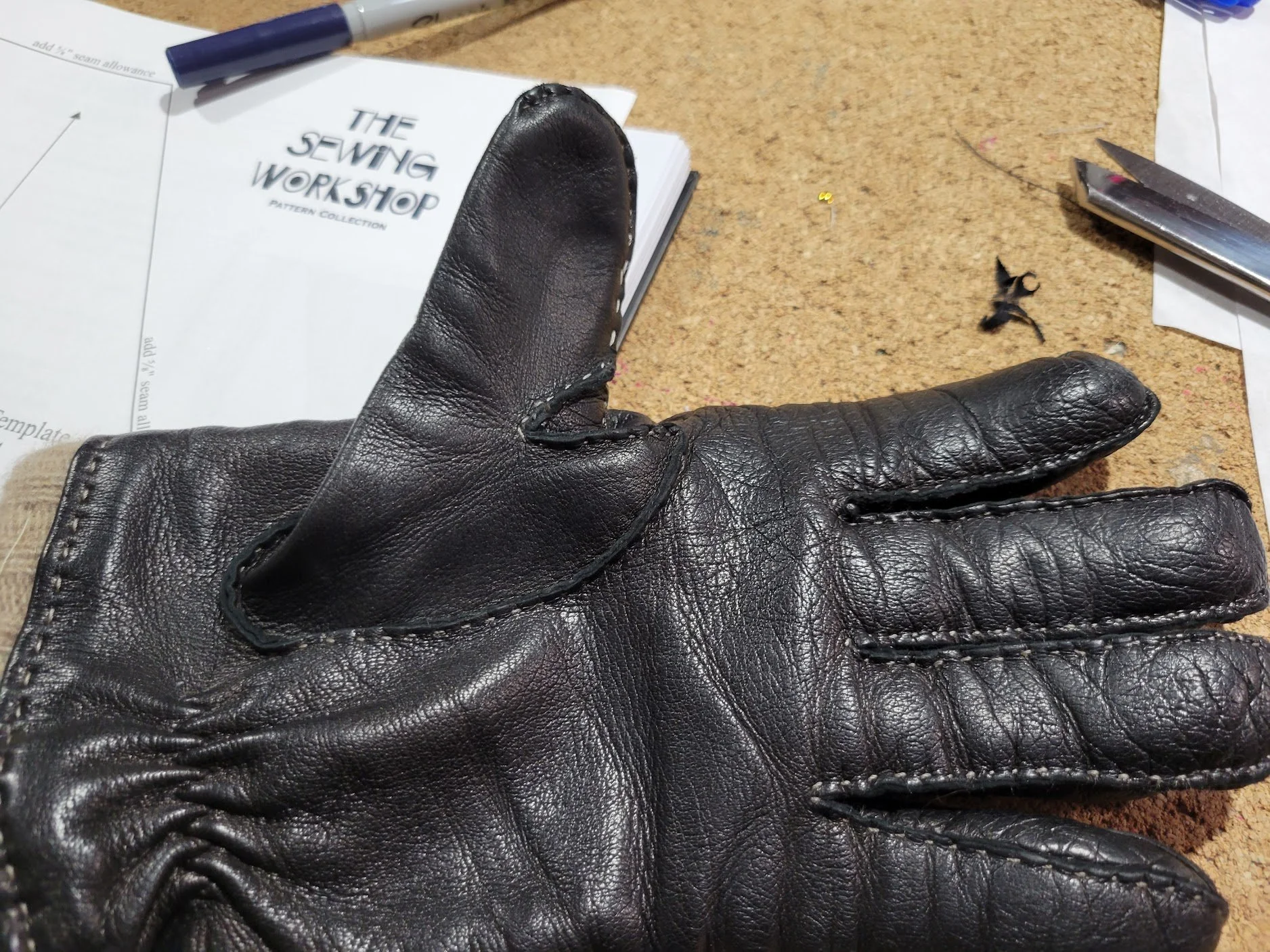 Repaired leather glove