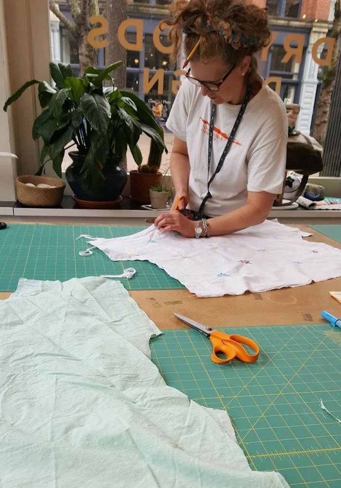 Theresa cutting fabric