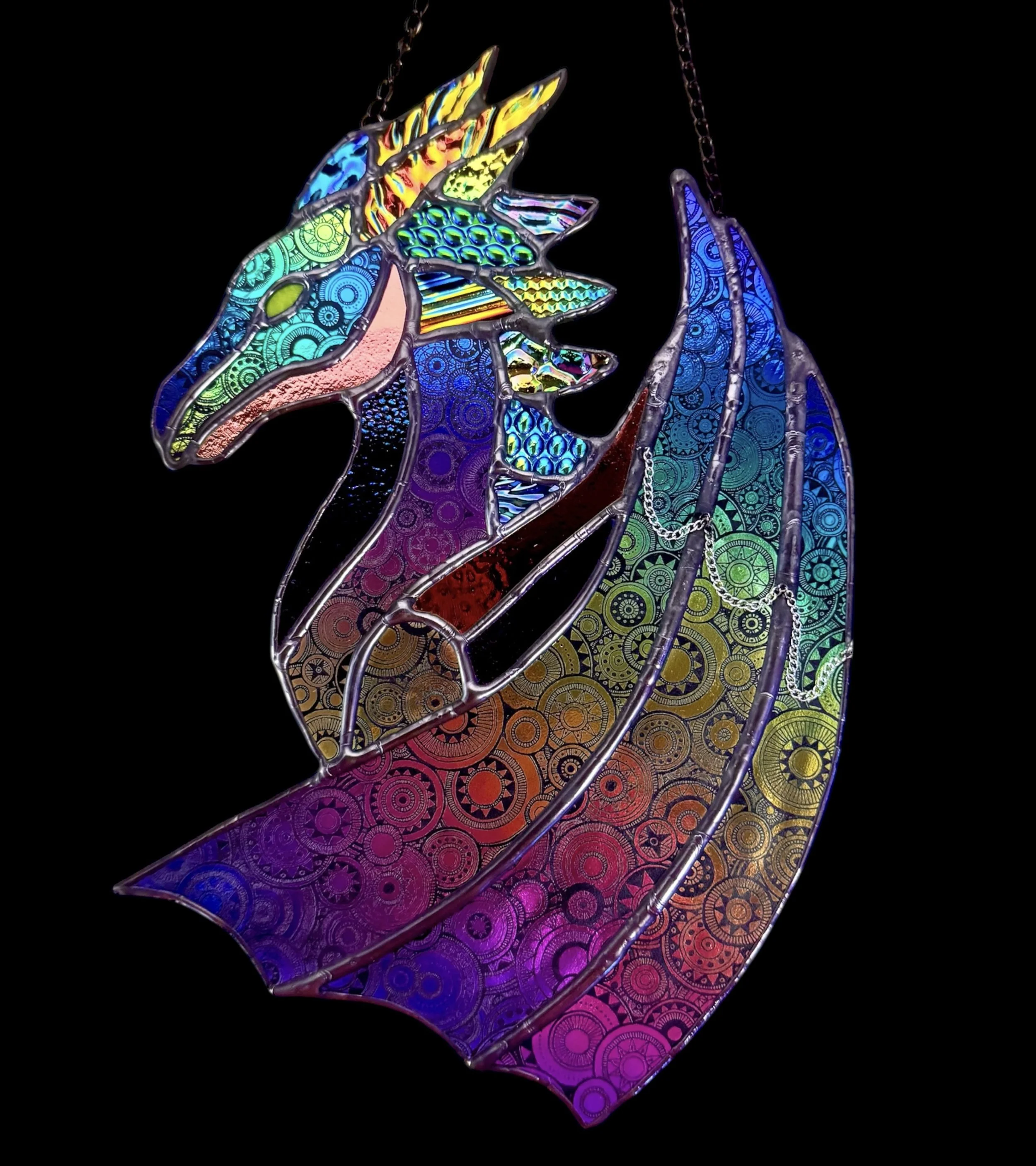 Colorful dichroic stained glass art dragon with intricate patterns and texture