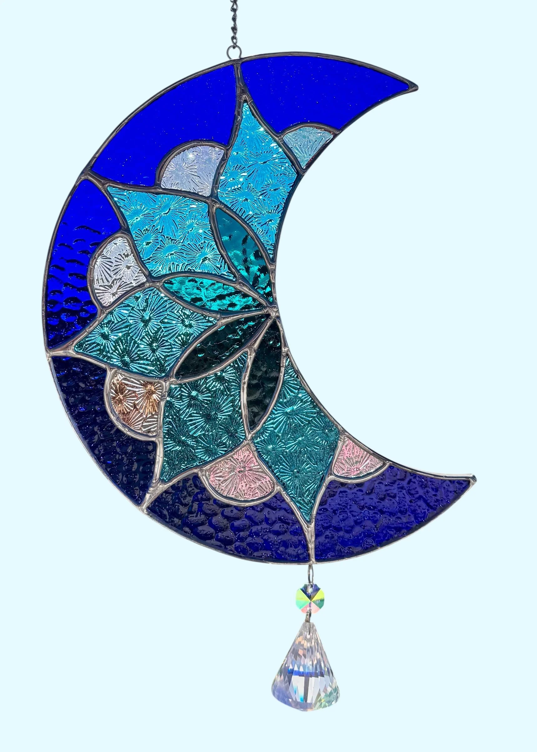 Stained glass Mandela moon with Dichroic Accents with a crystal drop.
