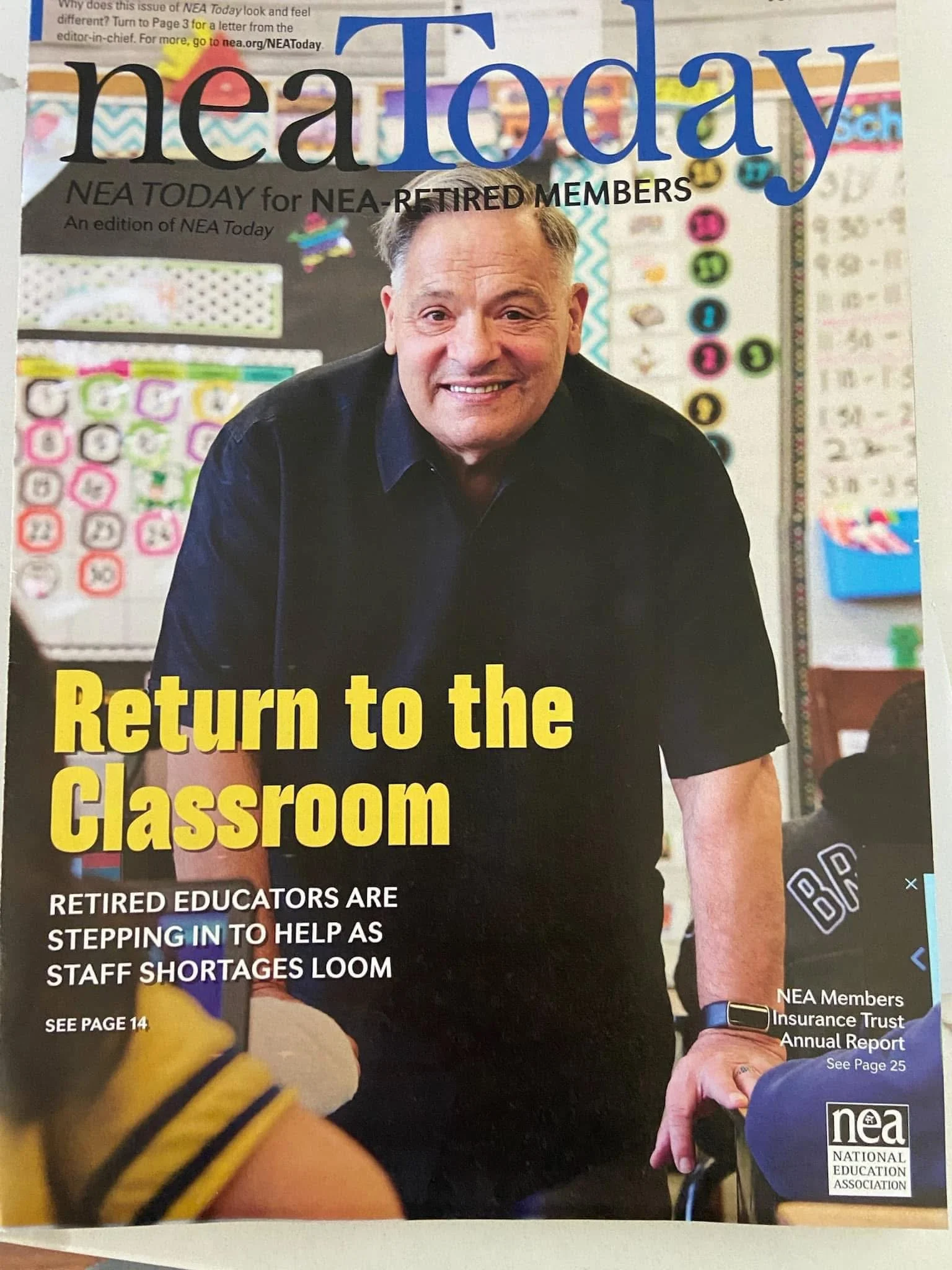 Cover of NEA Today magazine featuring a smiling man in a classroom with educational decorations in the background. The headline reads 'Return to the Classroom' and discusses retired educators helping with staff shortages.