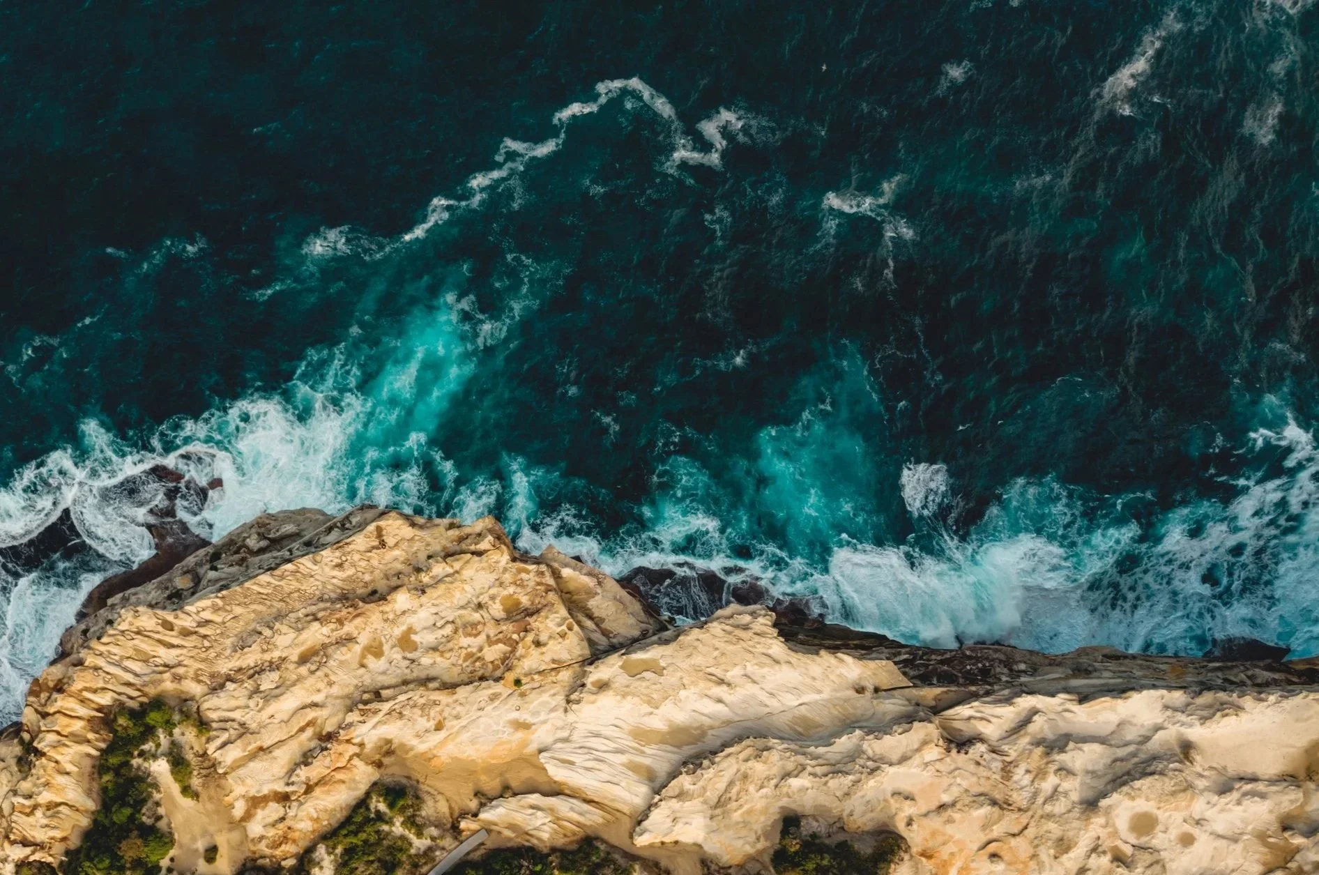 Rocks meeting the ocean in Australia.