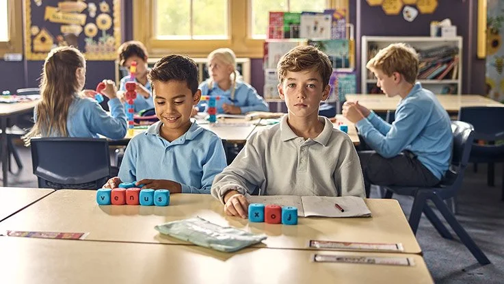 Two boys learning at school