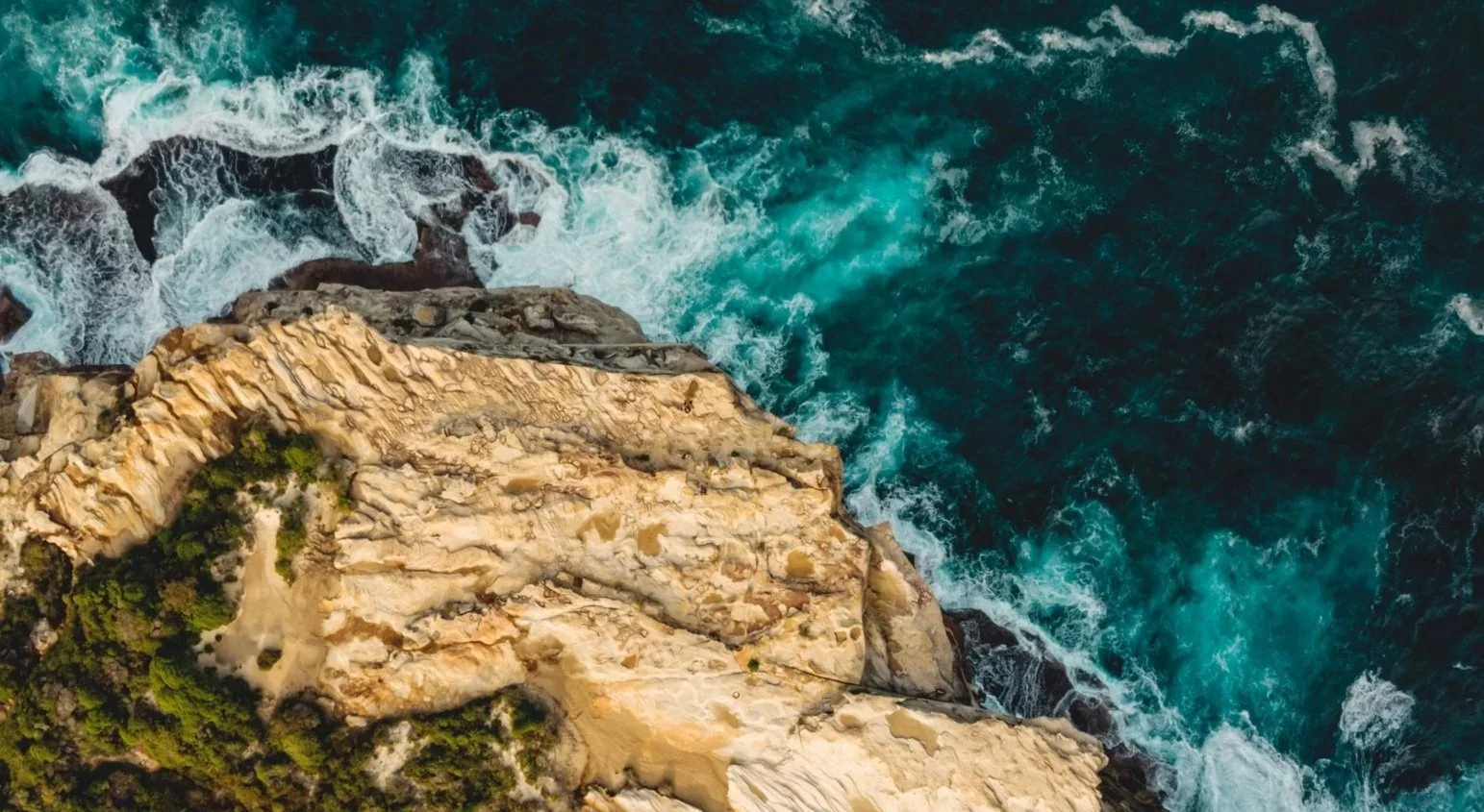 Natural rocky cliff meeting the ocean, Australian coastline