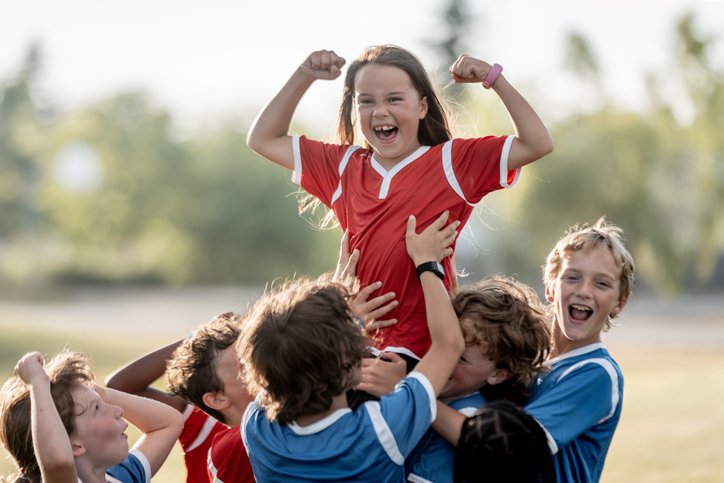 Boys and girls celebrating a soccer win, representing Sport & Recreation in the For-Purpose Sector