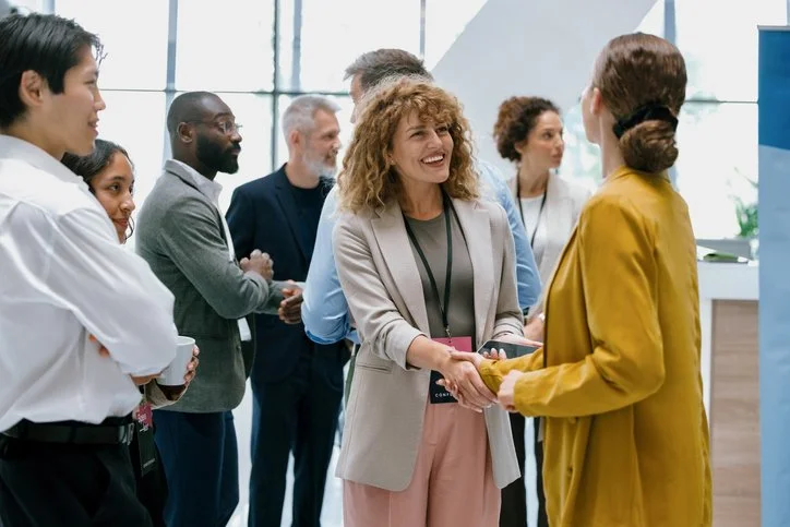 Group of people networking, representing Membership Groups & Peak Bodies in the For-Purpose Sector