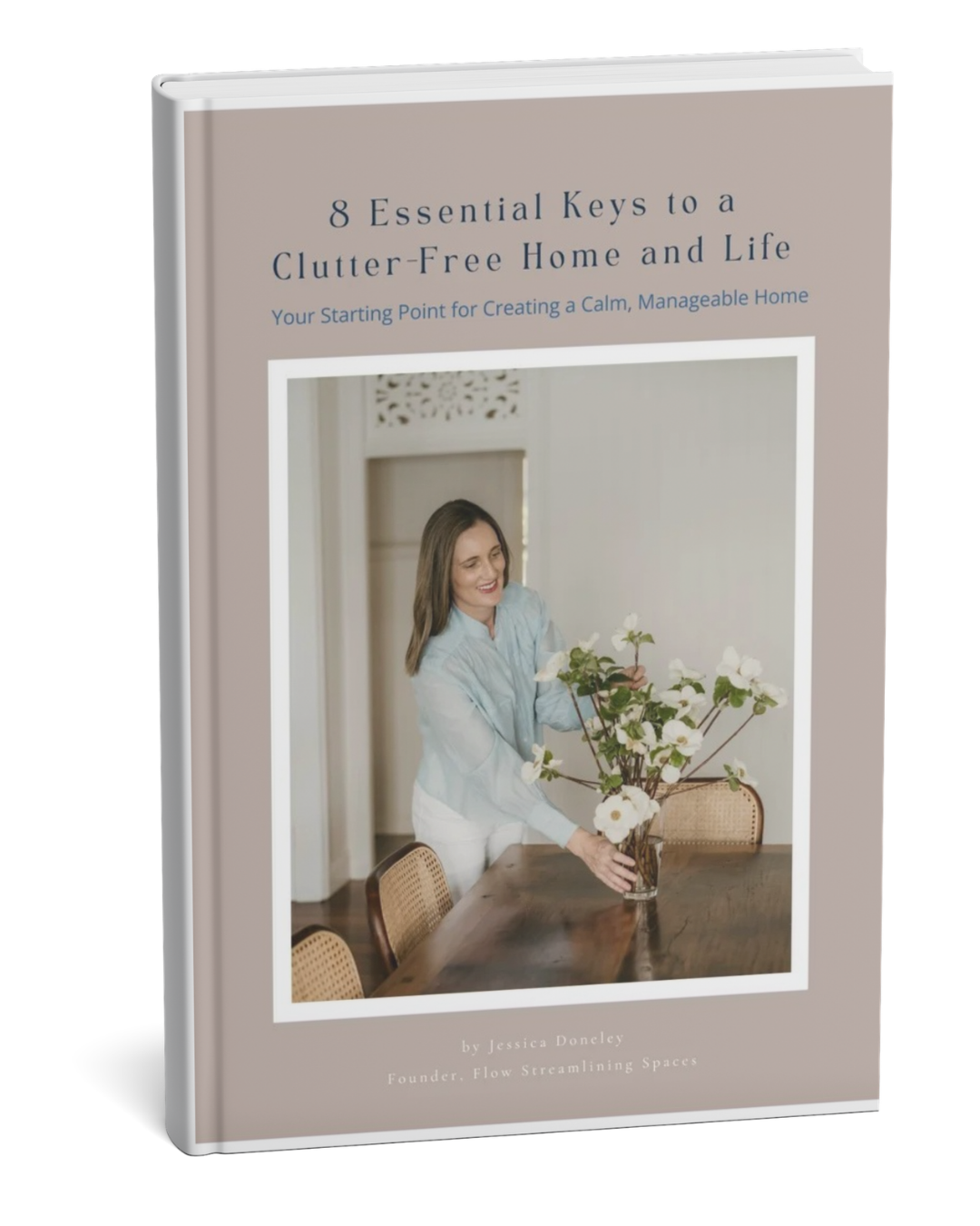 Cover of a book titled '8 Essential Keys to a Clutter-Free Home and Life' with a woman arranging flowers at a dining table.