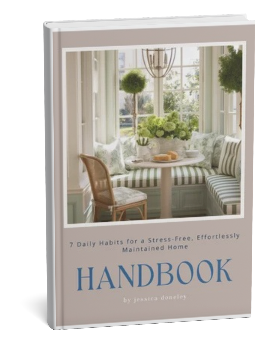 Book titled 'Handbook' with a cover image of a cozy sunlit breakfast nook featuring a round table, striped cushions, green plants, and large windows.