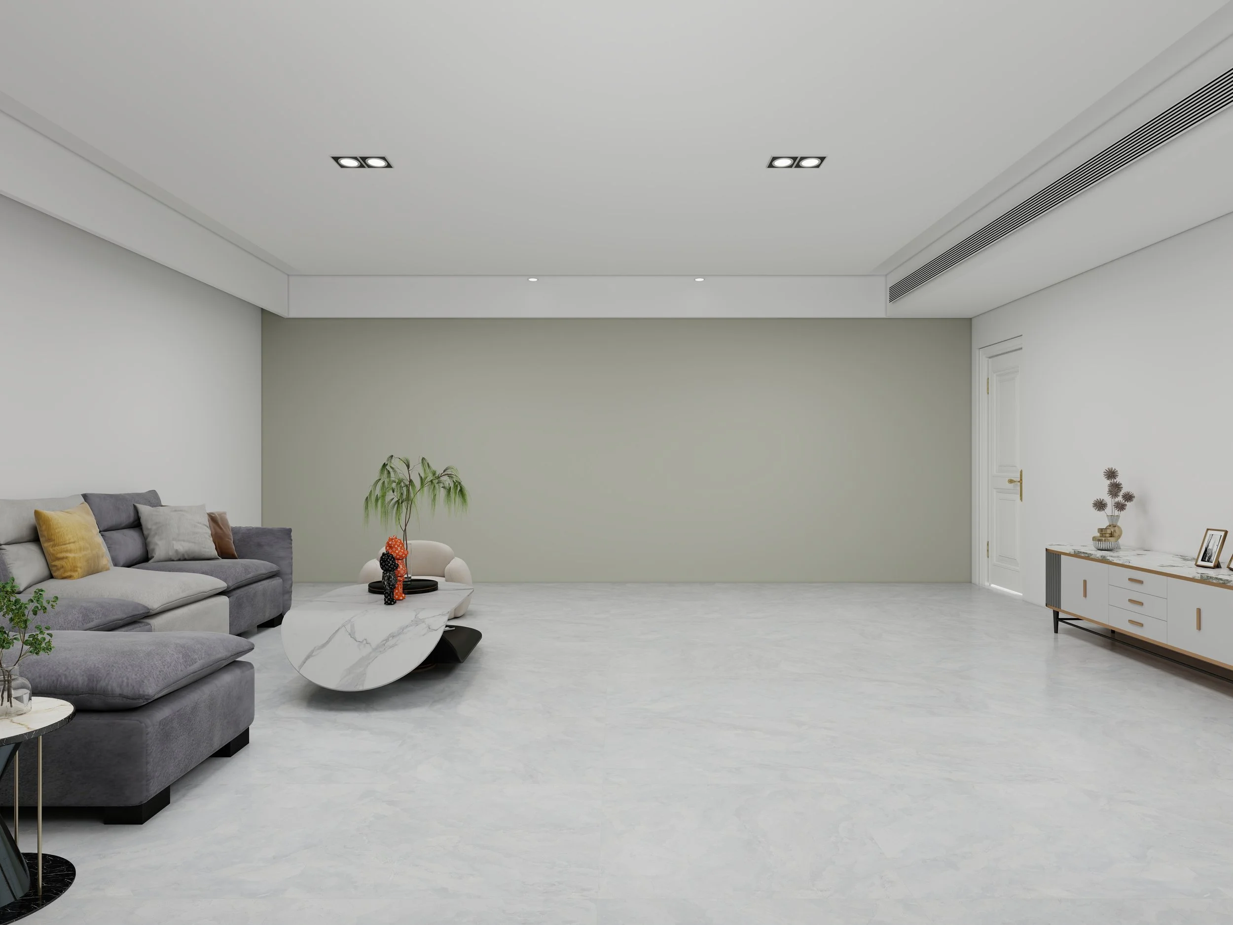 Living room with a gray sofa, pillows, a white marble coffee table with decorative items, a green plant, white walls, and a sideboard with decor. Ceiling has recessed lighting and air vents.