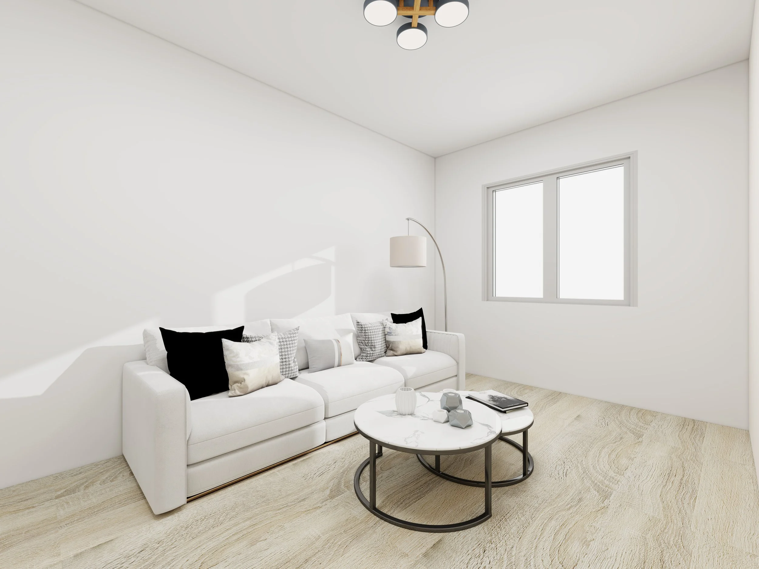 A bright, minimalistic living room with a white sofa decorated with black and gray pillows. A round marble coffee table with decorative vases and a book. Large windows letting in natural light, a floor lamp, and a modern ceiling light fixture.
