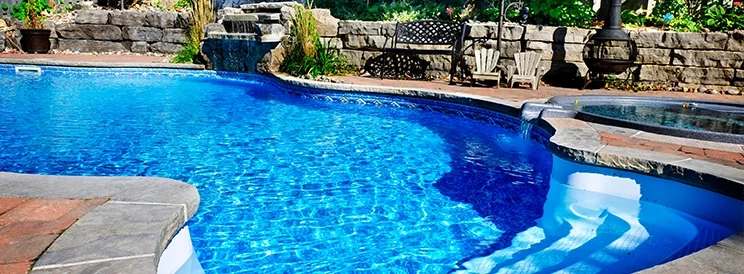 Fix-It Construction Services outdoor pool construction with stone patio and landscaping Harrisonburg VA