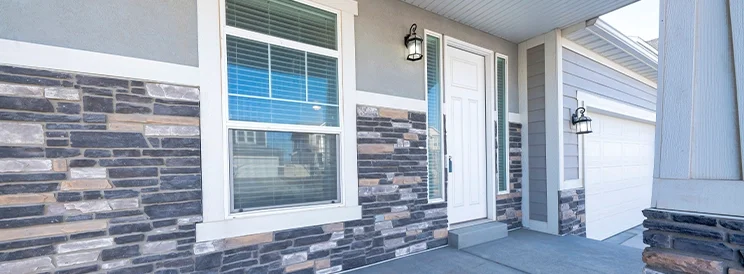 Fix-It Construction Services double hung window installation on home exterior near entry Harrisonburg VA