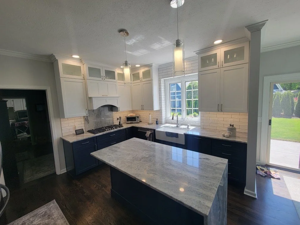 Fix-It Construction Services emergency plumbing repair at kitchen sink with tools Harrisonburg VA