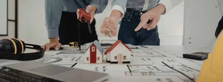 Fix-It Construction Services custom home design planning with blueprints and model houses Harrisonburg VA