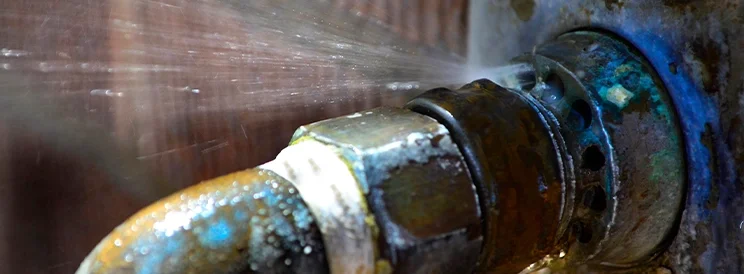 Fix-It Construction Services burst pipe spraying water requiring plumbing repair Harrisonburg VA