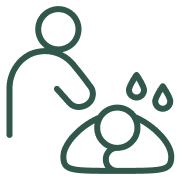 A person receiving a massage with water droplets on their head.