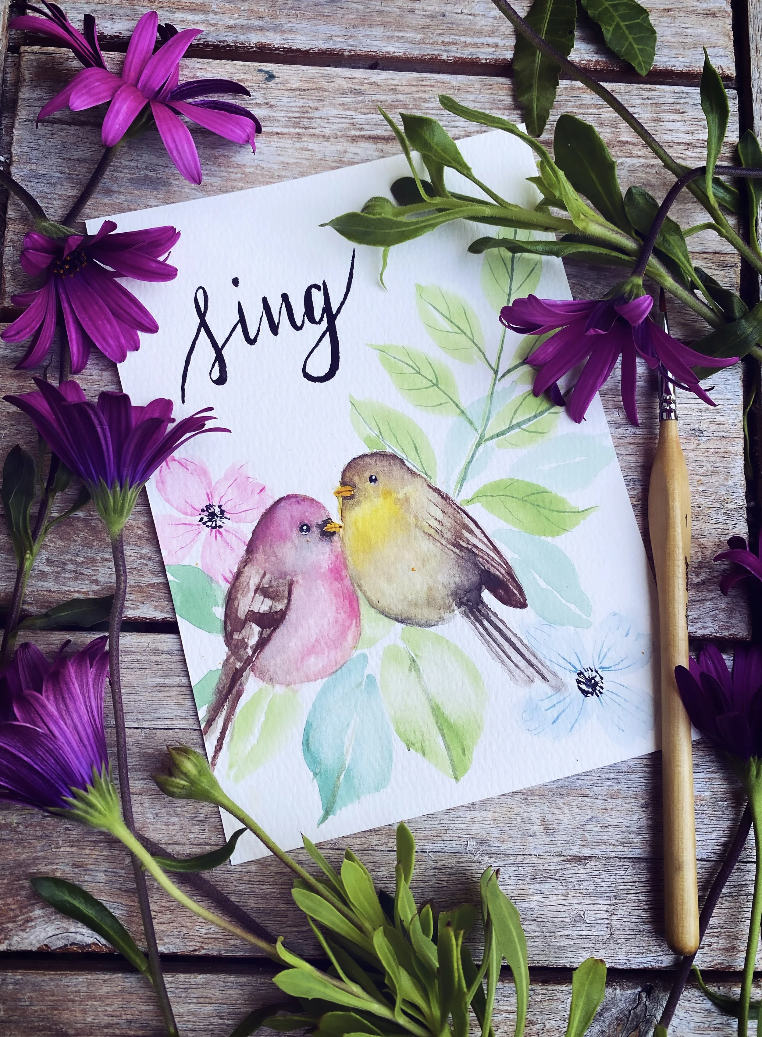 A soft floral card with lovebirds